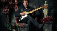 Drew Nelson with Stratocaster seated in chair